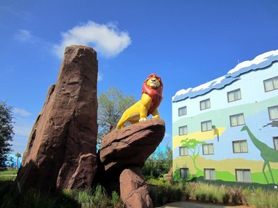 Mufasa stands majestically on Pride Rock.