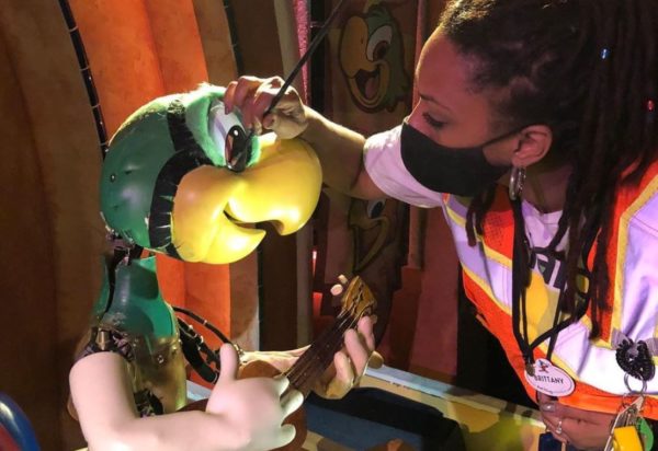 Disney Cast Member touches up on of The Three Caballeros audio-animatronics.  Photo credits (C) Disney Enterprises, Inc. All Rights Reserved 