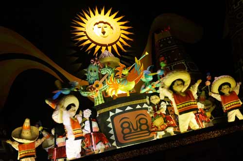 The animatronics in It's a Small World are dressed as many different nationalities from around the world representing world peace.