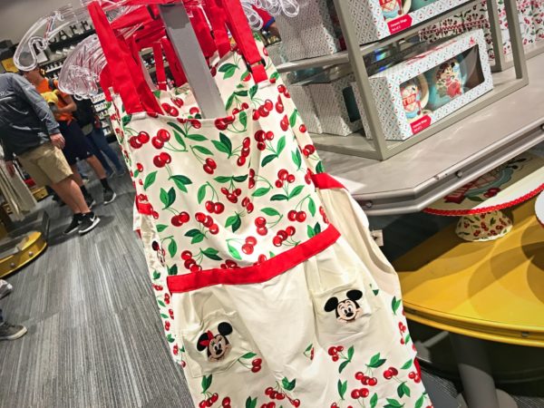 Mickey and Minnie adorn the front of this adorable apron . $34.99