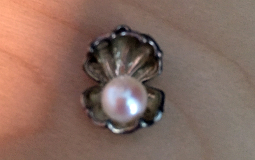 Here is an example of a pearl and a setting purchased at the Pick a Pearl counter in World Showcase's Japan.