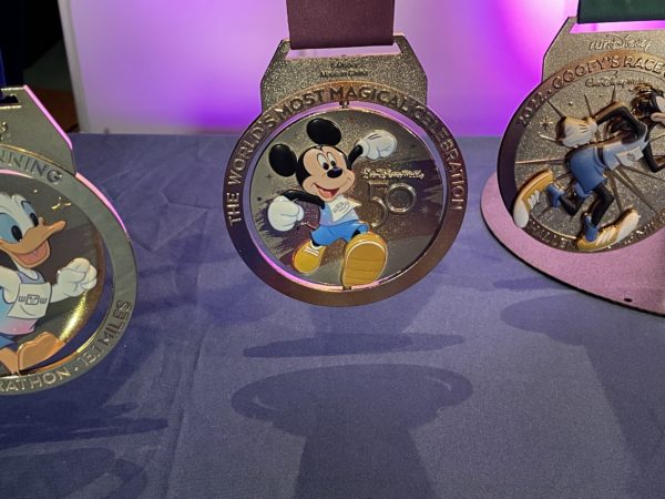 Marathon runners will love this spinning Mickey and Minnie medal!