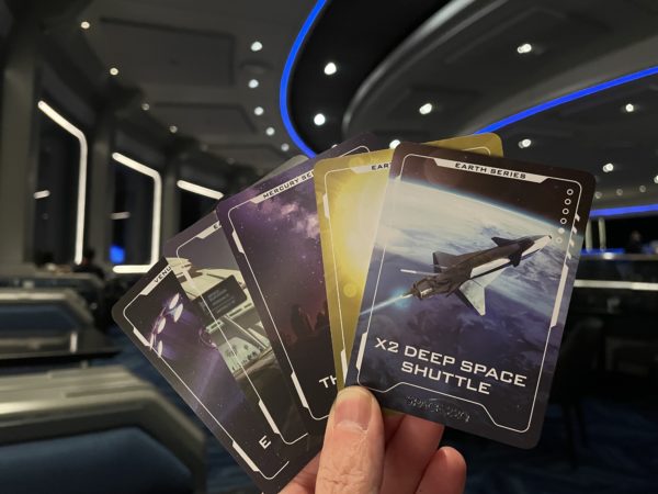 Each trading card has a spaceship on one side...