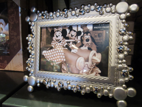 The Mickey heads on this picture frame are subtle enough that they could be overlooked.